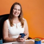 Smiling business woman at desk