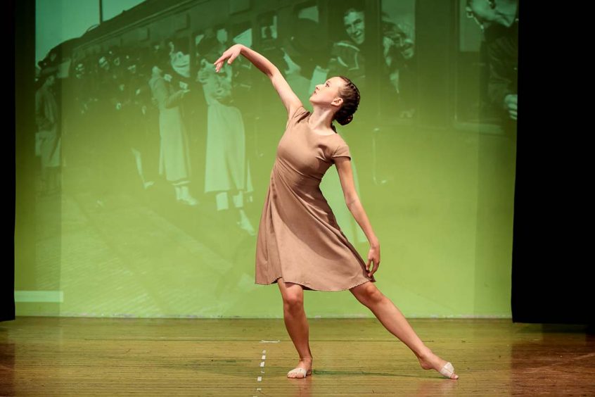 Contemporary dancer wearing a brown dress